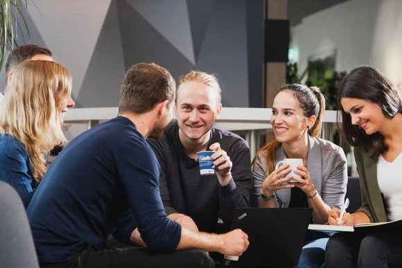 employeeengagement-intro group of people enjoying office coffee